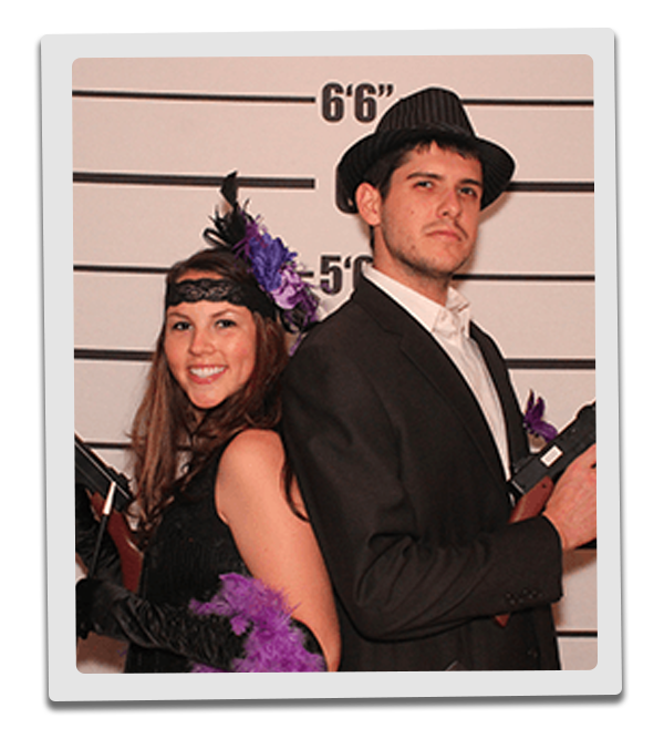 Nashville Murder Mystery party guests pose for mugshots