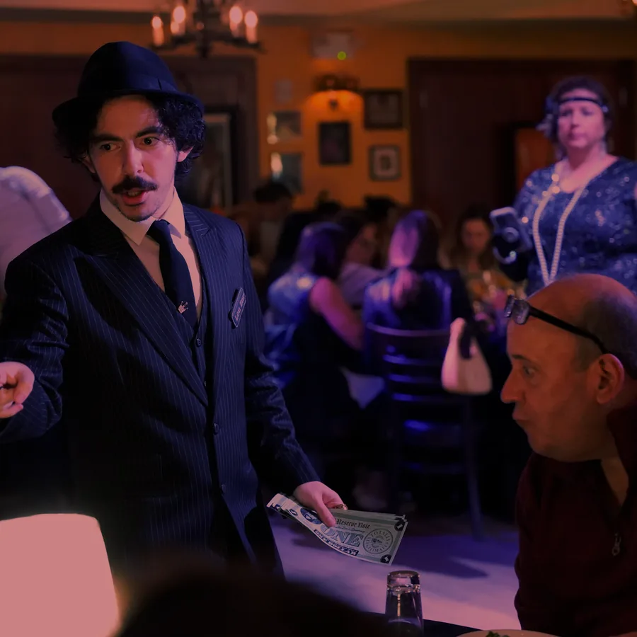 A Murder Mystery Company actor working the room at a Nashville show